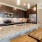 a kitchen with a marble island