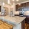 a kitchen with a marble island