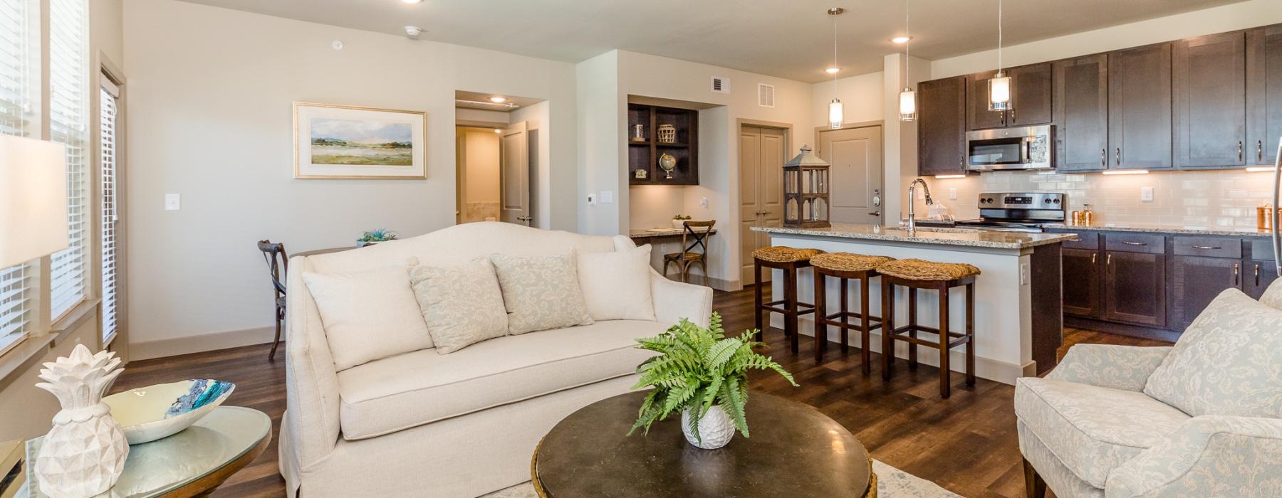 a large living room with a large kitchen and a dining table