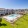 The pool area at Rosalia Silverlake 55 and Over Community in Pearland, TX, featuring lounge chairs and tables.