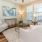 a living room with a chandelier and a couch